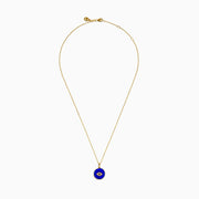 14K Yellow Gold Lapis and Diamond Evil Eye Disc Pendant features a gold chain and round pendant with a central evil eye design crafted from lapis and diamonds, set against a white background.