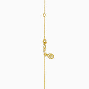 14K Yellow Gold Lapis and Diamond Evil Eye Disc Pendant features a gold chain and round pendant with a central evil eye design crafted from lapis and diamonds, set against a white background.