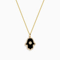 The Novelty 14K Yellow Gold Onyx and Diamond Hamsa Pendant features a black onyx hamsa hand accented with diamonds in a circular center design, shown on a yellow gold chain necklace against a white background.