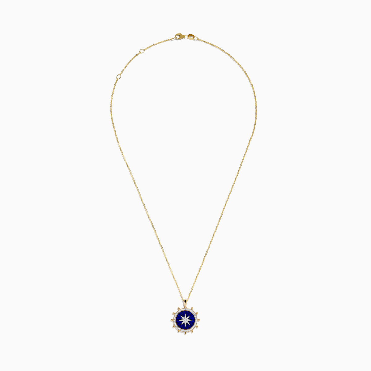 The Seaside 14K Yellow Gold Lapis and Diamond Compass Pendant features a gold chain and round lapis blue pendant with a white starburst design, accented by small gold beads, evoking a compass style. Shown on a plain white background.