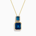 The 14K Yellow Gold London Blue Topaz and Diamond Pendant features two rectangular topaz stones—one accented with diamonds—suspended vertically from a fine gold chain.