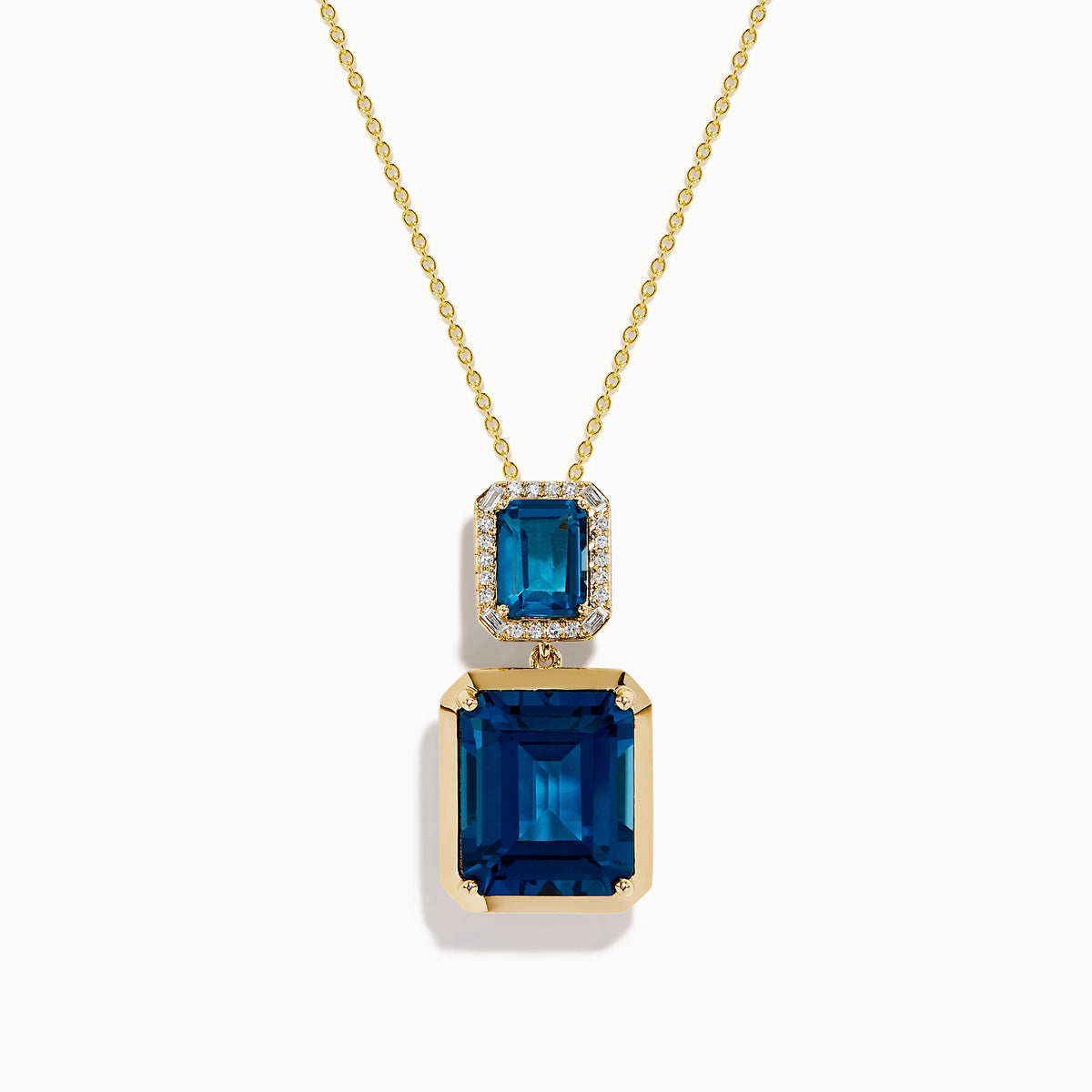 The 14K Yellow Gold London Blue Topaz and Diamond Pendant features two rectangular topaz stones—one accented with diamonds—suspended vertically from a fine gold chain.