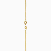 The 14K Yellow Gold London Blue Topaz and Diamond Pendant features two rectangular topaz stones—one accented with diamonds—suspended vertically from a fine gold chain.