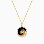 The Signature 14K Yellow Gold Onyx Emerald and Diamond Panther Pendant features a round onyx background, a detailed gold panther with an emerald green gemstone eye, and is surrounded by sparkling diamonds.