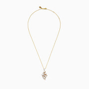The Aurora 14K Yellow Gold Opal and Diamond Pendant features clustered white opal stones and small diamonds set in gold, creating an organic, elegant design on a yellow gold chain necklace.