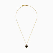 The 14K Yellow Gold Onyx and Diamond Heart Pendant features a glossy black onyx center surrounded by sparkling diamonds, all set on a yellow gold chain necklace.