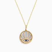 A 14K yellow gold necklace featuring a Mother of Pearl Evil Eye pendant, accented with diamonds and a sapphire gemstone, shown against a white background.