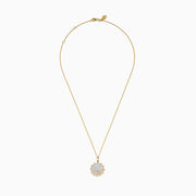 The Seaside 14K Yellow Gold Mother Of Pearl and Diamond Bird and Sea Pendant features a sun-inspired design with bird silhouettes, wave accents with diamonds, a mother-of-pearl background, and a delicate gold chain.