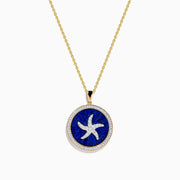 The Seaside 14K Yellow Gold Lapis and Diamond Starfish Pendant features a round lapis center with a white starfish design and a border of sparkling diamonds.