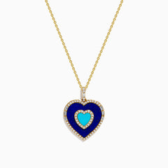 The Novelty 14K Yellow Gold Lapis, Turquoise and Diamond Heart Pendant features a turquoise heart center framed by lapis-blue and bordered with sparkling diamonds on a gold chain.