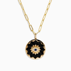 14K yellow gold evil eye pendant featuring sapphire, onyx, and diamond accents, displayed against a white background.