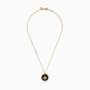 14K yellow gold evil eye pendant featuring sapphire, onyx, and diamond accents, displayed against a white background.