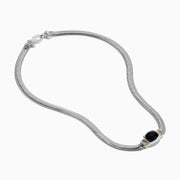 The Eclipse 925 Sterling Silver and 14K Yellow Gold Onyx Necklace features a snake chain and a central black onyx gemstone in an elegant silver and yellow gold-accented setting.