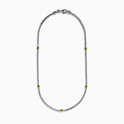 The Mens 925 Sterling Silver Black Spinel Necklace features three evenly spaced gold settings with small round black gemstones for a simple, elegant look.