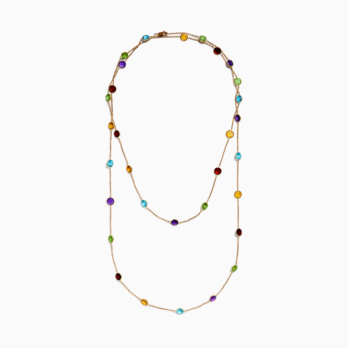 The 14K Rose Gold Multi Color Gemstone Station Necklace features evenly spaced oval gemstones in blue, green, purple, yellow, and red, shown against a white background.