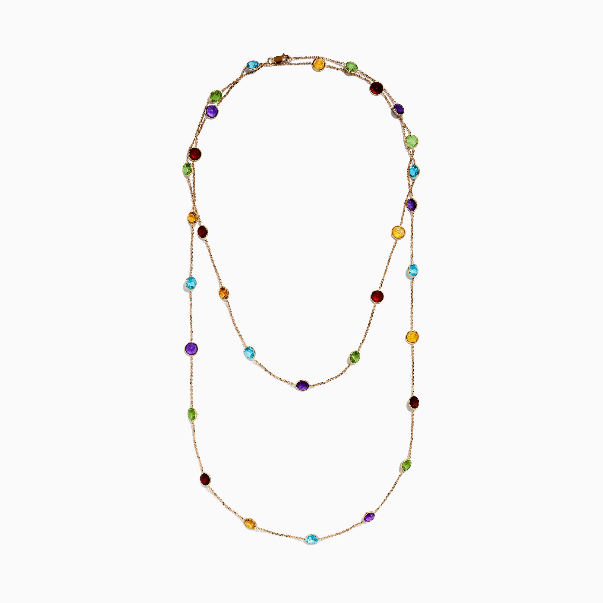 The 14K Rose Gold Multi Color Gemstone Station Necklace features evenly spaced oval gemstones in blue, green, purple, yellow, and red, shown against a white background.