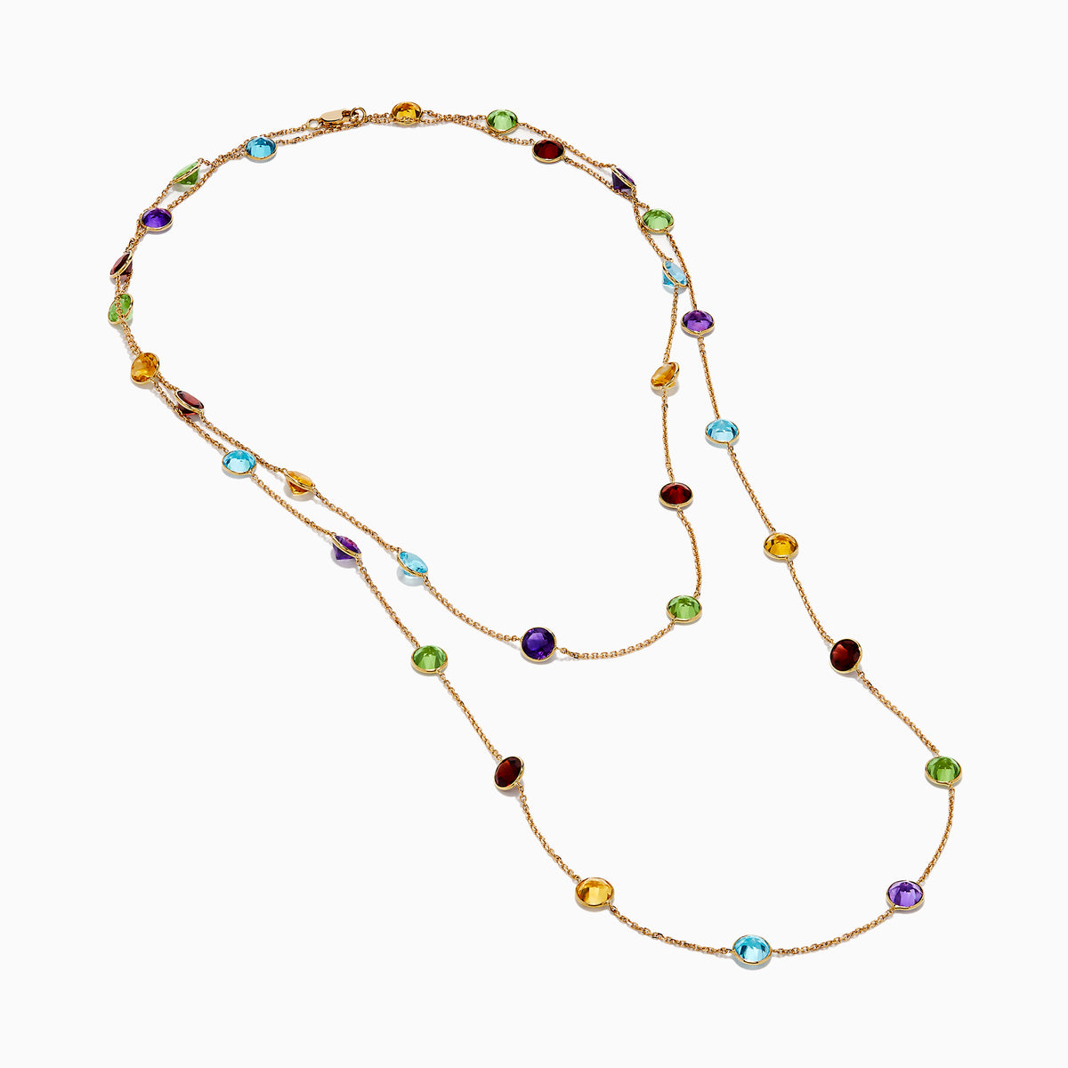 The 14K Rose Gold Multi Color Gemstone Station Necklace features evenly spaced oval gemstones in blue, green, purple, yellow, and red, shown against a white background.