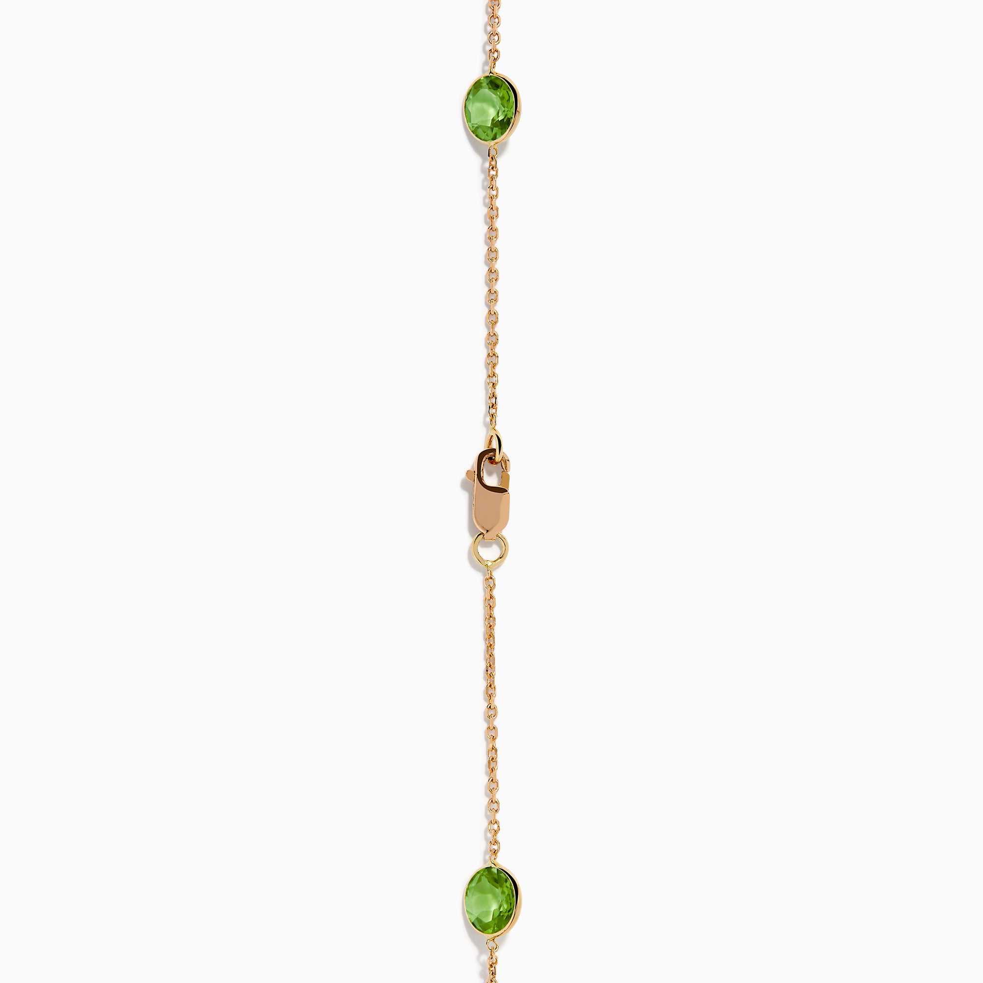 The 14K Rose Gold Multi Color Gemstone Station Necklace features evenly spaced oval gemstones in blue, green, purple, yellow, and red, shown against a white background.