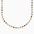 The 14K Yellow Gold Multi-Gemstone Bezel Heart Station Necklace showcases vibrant heart-shaped gemstones bezel-set and evenly spaced along a delicate yellow gold chain.