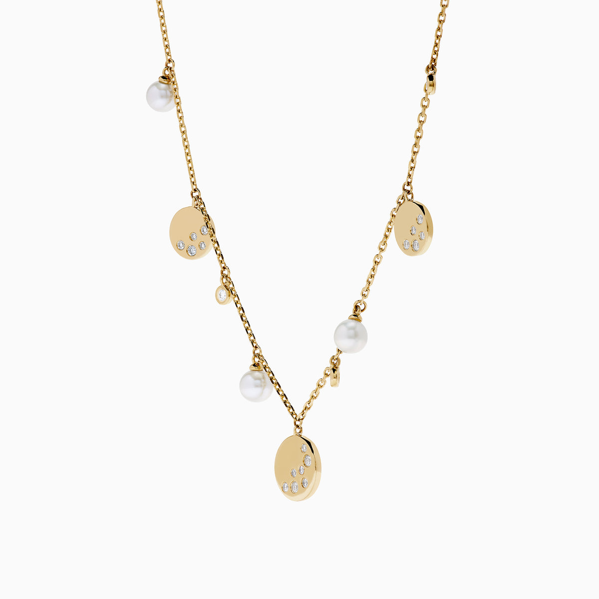 The 14K Yellow Gold Pearl and Diamond Necklace features small round charms and lustrous pearls, with some charms adorned with sparkling diamonds, creating an elegant and delicate design against a white background.