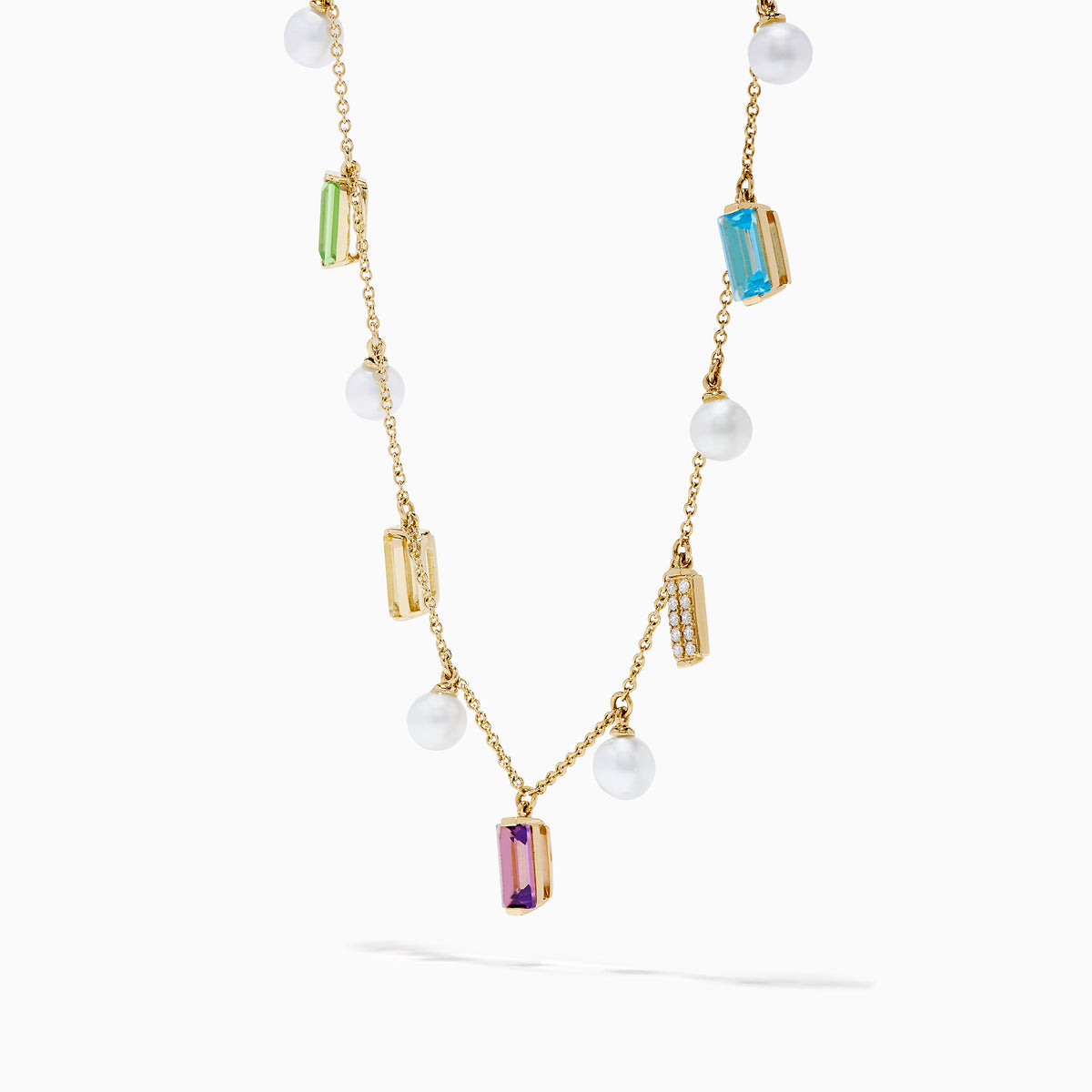 The Mosaic 14K Yellow Multi Color Gemstone Freshwater Pearl and Diamond Necklace features evenly spaced freshwater pearls with green, yellow, purple, clear, and blue gemstones, all set in 14K yellow gold.