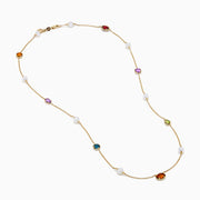 The Mosaic 14K Yellow Multi Color Gemstone and Fresh Water Pearl Station Necklace features evenly spaced blue, orange, and green gemstones with fresh water pearls on a gold chain, displayed on a white background.