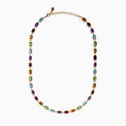 The 14K Yellow Gold Multi Color Gemstone Bezel Necklace features bezel-set rectangular purple, orange, green, and blue gemstones evenly spaced along the chain.