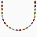 The 14K Yellow Gold Multi Color Gemstone Bezel Necklace features bezel-set rectangular purple, orange, green, and blue gemstones evenly spaced along the chain.