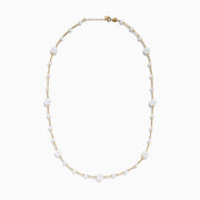 The 14K Yellow Gold Cultured Fresh Water Pearl Station Necklace features small, evenly spaced pearls along a fine gold chain for an elegant, minimalist look. Pearls vary slightly in size for added delicacy.