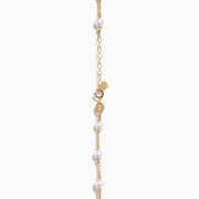 The 14K Yellow Gold Cultured Fresh Water Pearl Station Necklace features small, evenly spaced pearls along a fine gold chain for an elegant, minimalist look. Pearls vary slightly in size for added delicacy.