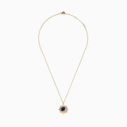 The 14K Yellow Gold Lapis and Diamond Celestial Sunburst Pendant features a blue lapis center, gold stars, a diamond-set crescent, and an elongated gold chain for an elegant celestial touch.