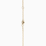 The 14K Yellow Gold Lapis and Diamond Celestial Sunburst Pendant features a blue lapis center, gold stars, a diamond-set crescent, and an elongated gold chain for an elegant celestial touch.