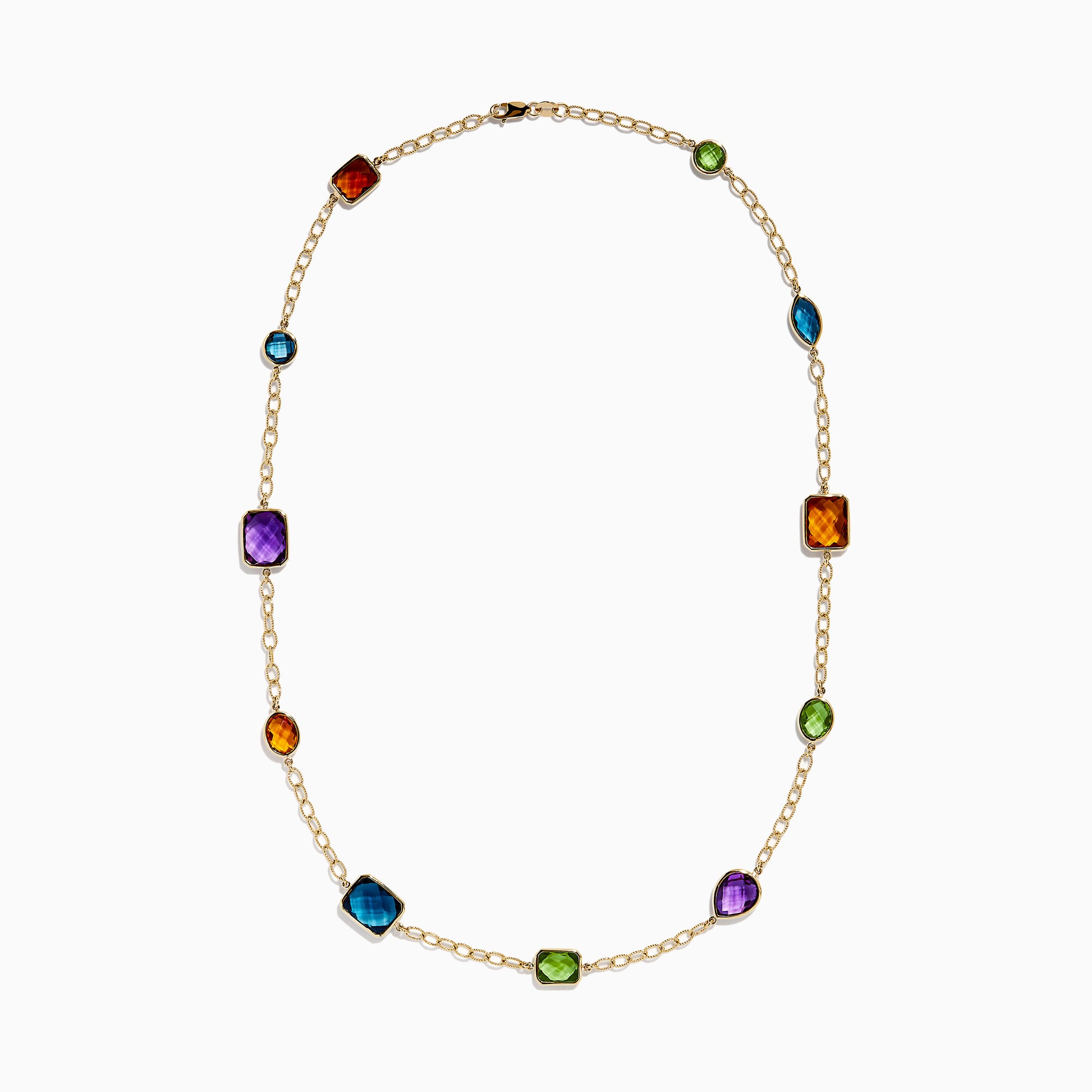 The 14K Yellow Gold Multi-Gemstone Mixed-Shape Station Necklace features seven bezel-set, faceted gemstones in vibrant orange, blue, green, and purple hues, elegantly spaced along the chain.