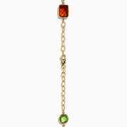The 14K Yellow Gold Multi-Gemstone Mixed-Shape Station Necklace features seven bezel-set, faceted gemstones in vibrant orange, blue, green, and purple hues, elegantly spaced along the chain.