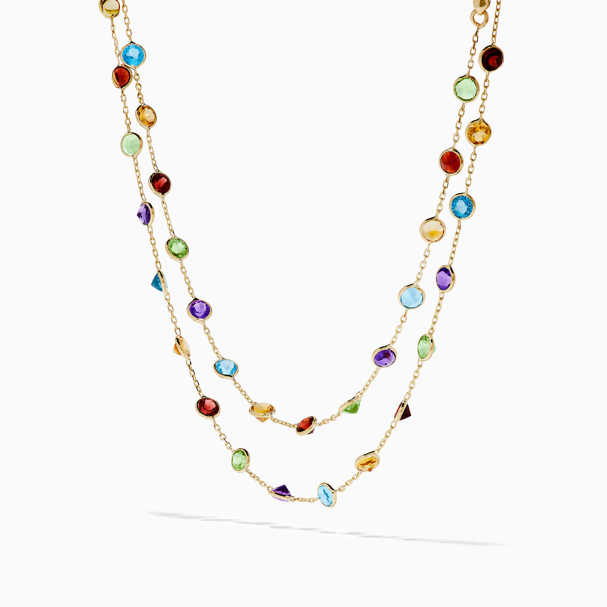 The Mosaic 14K Yellow Gold Multi Color Gemstone and Diamond Necklace features a delicate gold chain adorned with beautifully spaced round gemstones in blue, green, purple, red, and yellow.