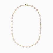 The 14K Yellow Gold Pink Freshwater Pearl Necklace features a single strand of evenly spaced pink freshwater pearls linked by small yellow gold connectors and finished with a gold clasp.