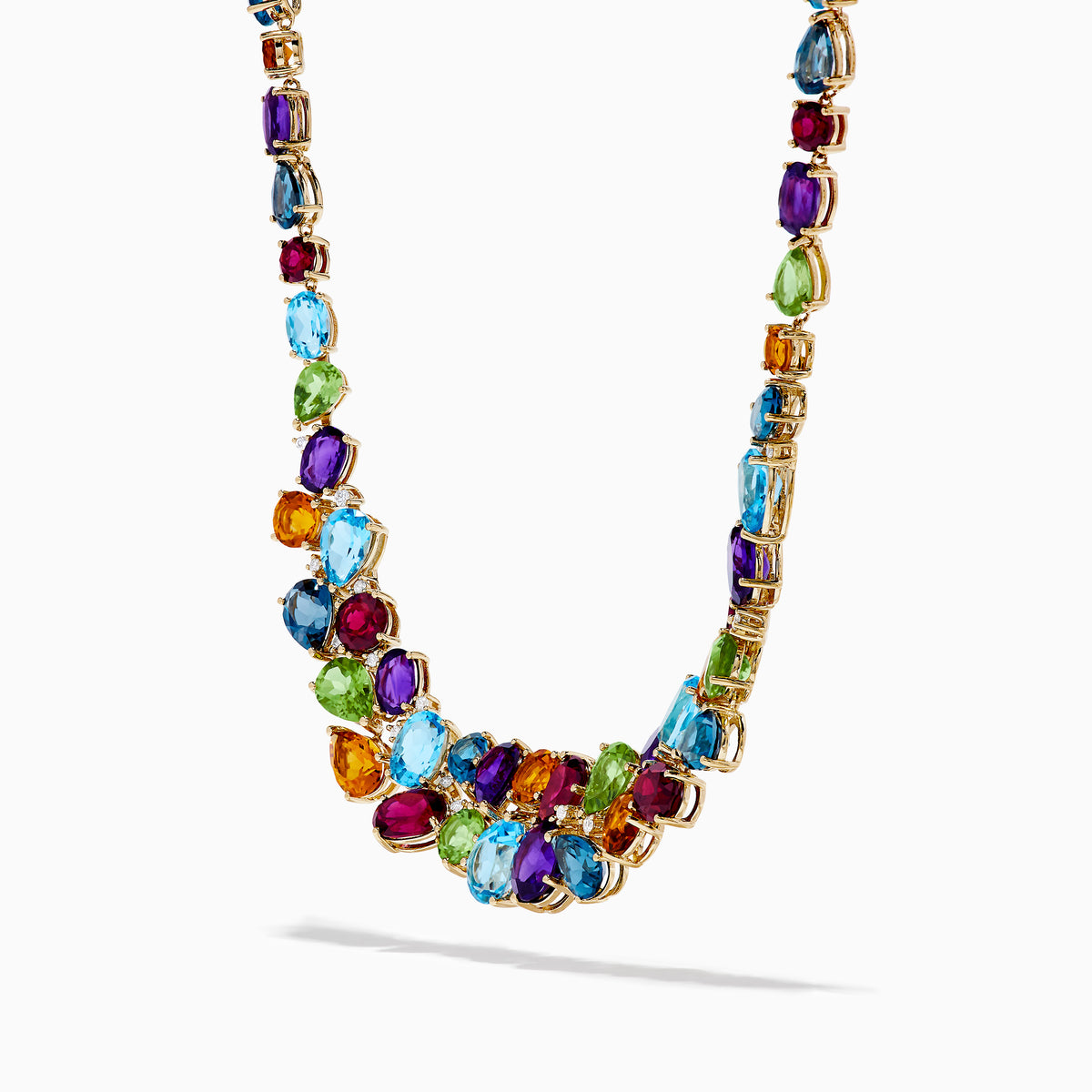The Mosaic 14K Yellow Gold Multi Color Gemstone and Diamond Necklace showcases oval and teardrop-shaped blue, green, orange, purple, and dark red stones in a symmetrical design set in gold on a white background.