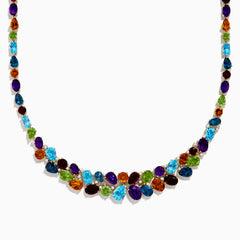 The Mosaic 14K Yellow Gold Multi Color Gemstone and Diamond Necklace showcases oval and teardrop-shaped blue, green, orange, purple, and dark red stones in a symmetrical design set in gold on a white background.