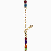The Mosaic 14K Yellow Gold Multi Color Gemstone and Diamond Necklace showcases oval and teardrop-shaped blue, green, orange, purple, and dark red stones in a symmetrical design set in gold on a white background.