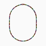 The 14K Yellow Gold Multi-Gemstone Rainbow Tennis Necklace features small, round gemstones spaced along its length and is shown on a white background.