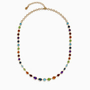 The Mosaic 14K Yellow Gold Multi Gemstone Necklace showcases small round and teardrop-shaped gems set on a gold chain, displayed against a white background.