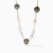 The 14K Yellow Gold Tahitian and Freshwater Pearl Necklace features alternating white and dark pearls on a delicate gold chain, beautifully displayed against a white background.