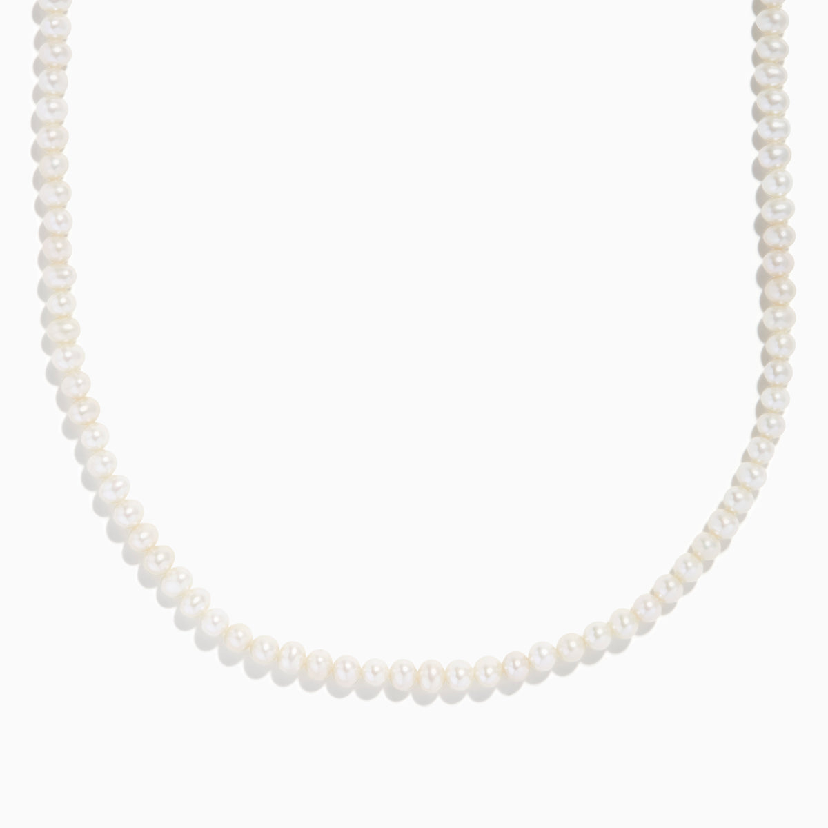 The 14K Yellow Gold Freshwater Pearl and Paperclip Chain Necklace features small white freshwater pearls strung on the lower section, connected to a delicate gold paperclip chain, shown on a plain white background.