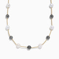 The 14K Yellow Gold Tahitian and Fresh Water Pearl Necklace features alternating black Tahitian pearls and white freshwater pearls, evenly spaced along a yellow gold chain and shown on a white background.