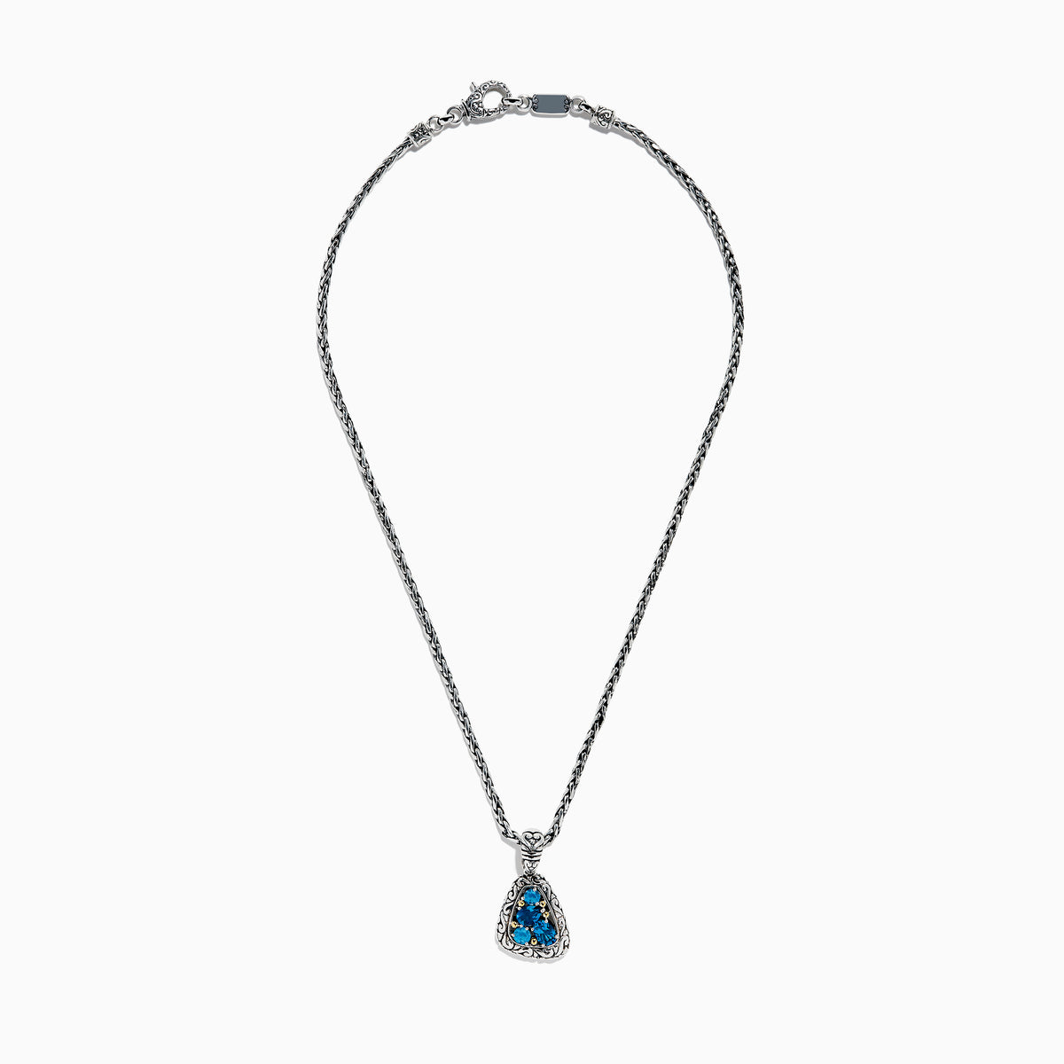 A 925 sterling silver and 18K yellow gold pendant with an ornate chain, featuring a triangular London blue and blue topaz set in an intricate frame.