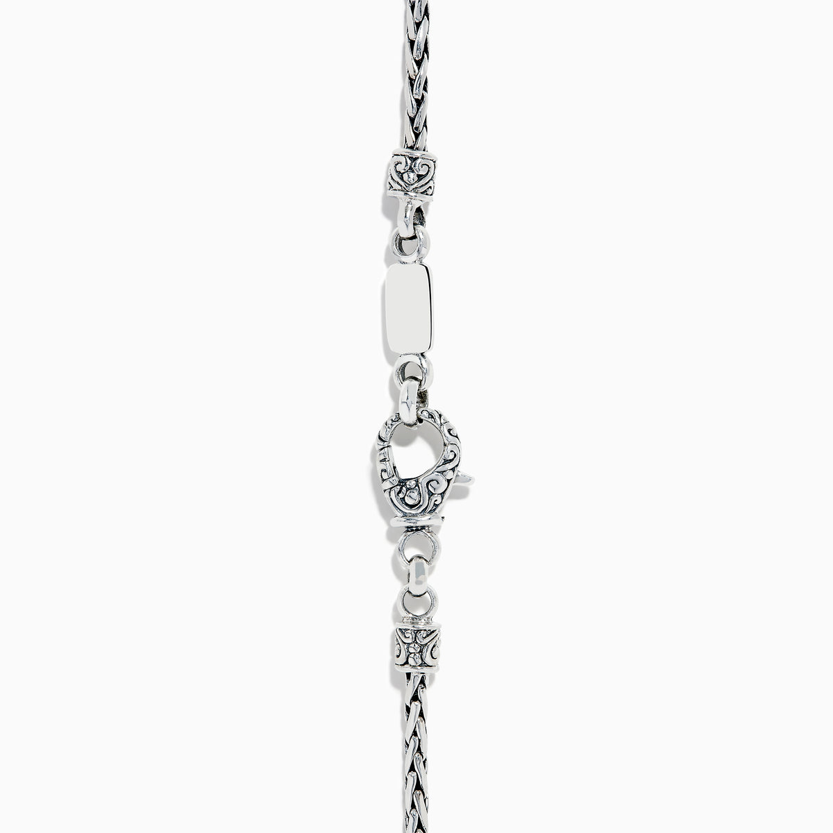 A 925 sterling silver and 18K yellow gold pendant with an ornate chain, featuring a triangular London blue and blue topaz set in an intricate frame.