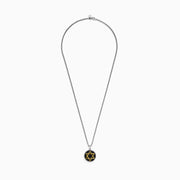 Men’s 925 sterling silver and gold plated Star of David pendant features black spinel on a textured black background, hung from a chain necklace.