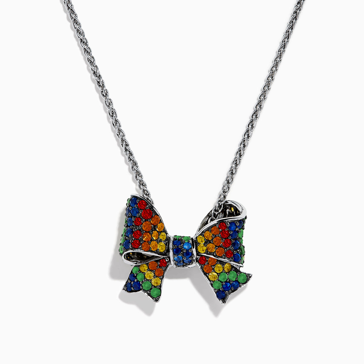 The Splash 925 Sterling Silver Multi Color Sapphire Bow Pendant showcases a stunning bow design adorned with sapphires in a vibrant rainbow pattern.