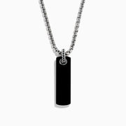 The Men's Sterling Silver Onyx Dog Tag Pendant features a simple rectangular onyx set in sterling silver, suspended from a chain and displayed against a plain white background.