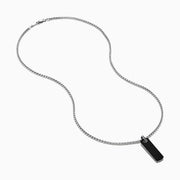 The Men's Sterling Silver Onyx Dog Tag Pendant features a simple rectangular onyx set in sterling silver, suspended from a chain and displayed against a plain white background.